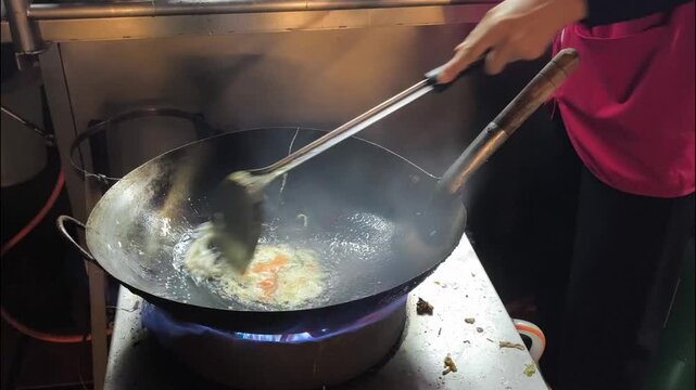 Cooking stir-fried sukiyaki in pan, Street food Chiangmai Thailand.