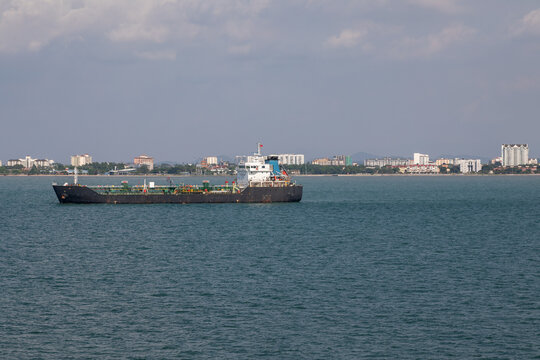 A bulk carrier ship in the harbor near Swettenham, Penang Island, Malaysia on a Hazy Spring Day