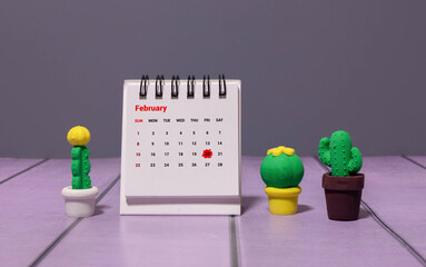 Minimalist white wooden block perpetual calendar displaying FEBRUARY 20