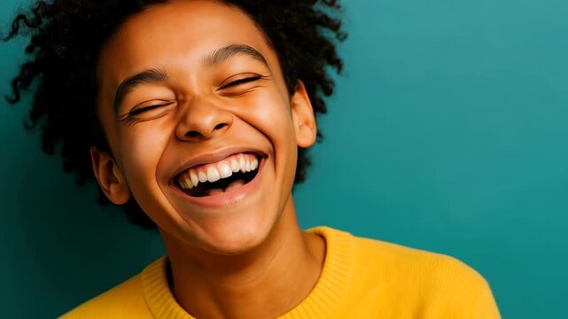 Joyful Expression: A moment of pure delight captured as an individual radiates with laughter, showcasing genuine happiness and infectious joy.