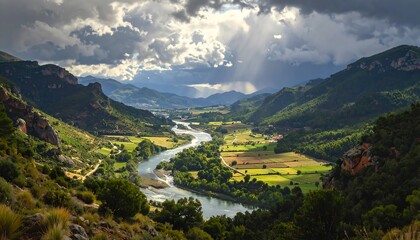 A scenic valley, a river snakes between green hills, bathed in sunlight breaking through the cloudy sky