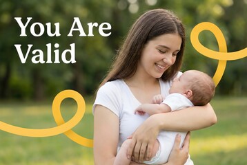 Happy young mother holding newborn baby outdoors with yellow ribbon and You Are Valid text symbolizing suicide prevention awareness and mental health support