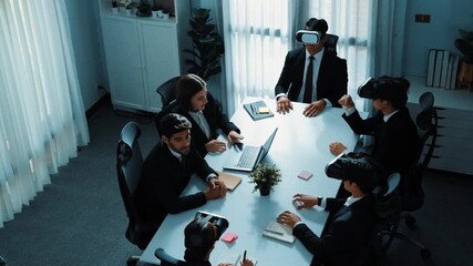 Top view of manager working on laptop and sending data analysis to business people by using VR glass headset while diverse team moving gesture while working together to planning idea. Directorate. - Powered by Adobe