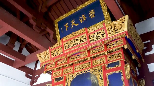 Huo Shen Tai in Shangqiu City, Henan Province, China, is also known as QueBo Tai. The Caishen Hall and the Caishen statue within the Huo Shen Tai scenic area. 