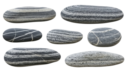 Different types of smooth stones with unique patterns arranged on a flat surface in natural colors