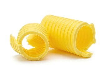 Golden yellow butter curls arranged beautifully on a pristine white background, ready for serving or cooking, smooth, elegance, gourmet