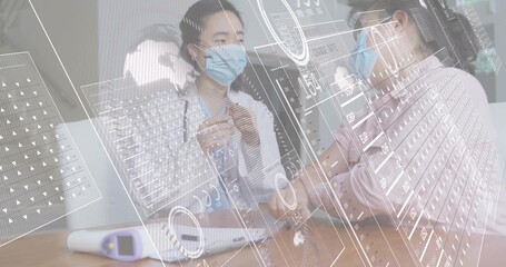 Adjusting masked doctor in white coat wearing stethoscope checking masked patient arm at table, HUD