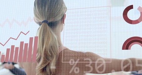 Woman with blonde ponytail in light tank top studying data overlay in office, with binary charts