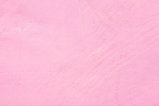 pink Grunge Mint Sandstone Painted Stucco Wall Texture. Seamless concrete texture background with space for text or image. Old rough and grunge cement wall in light pink color