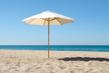 Fototapeta premium Peaceful Beach Scene with a White Umbrella on Soft Sand by the Ocean