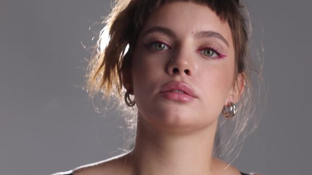 Plus Size Model in Red Corset on White Cyc Wall