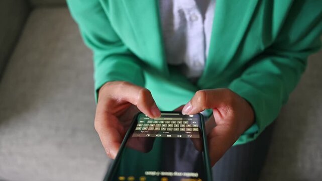 Woman's hands texting message on smartphone keyboard, video 4k real time