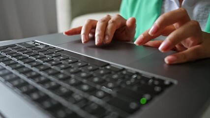 Woman's hands using laptop computer touchpad for business, video 4k real time - Powered by Adobe