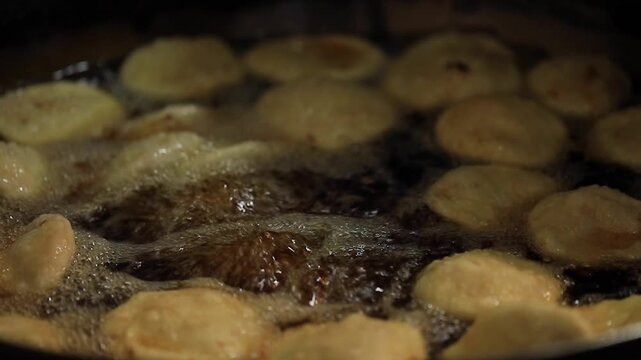 kachori frying in oil. Indian street food.