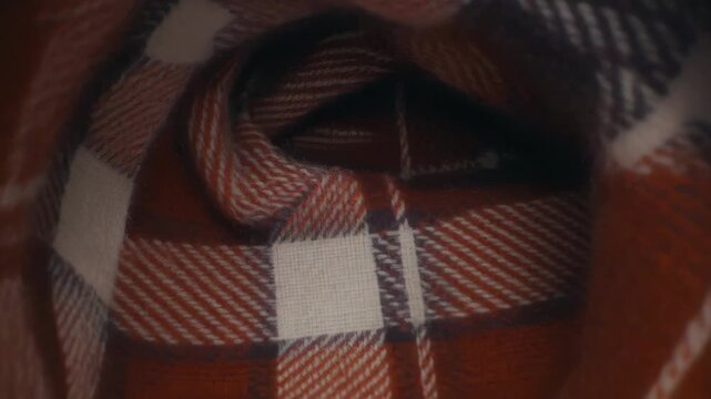 Closeup Shot Of Red Plaid Scarf With White And Black Stripes On Black