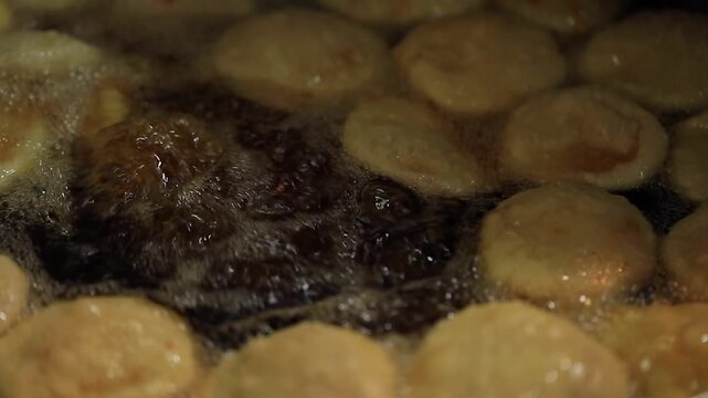 kachori frying in oil. Indian street food.