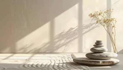 Stickers Stenen in het zand Zen meditation corner with stacked stones, dried flowers, and sand patterns, illuminated by soft sunlight and shadows for a peaceful ambiance.  © Chalita