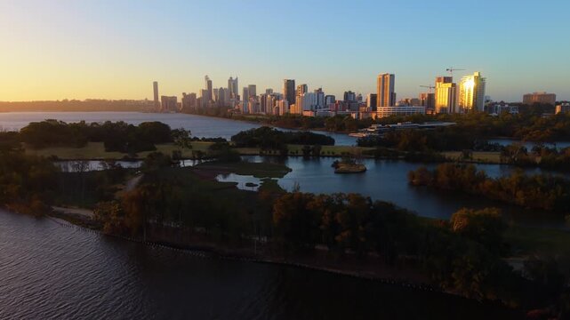 Revealing Perth city skyline from behind the iconic Herisson Island in Western Australia