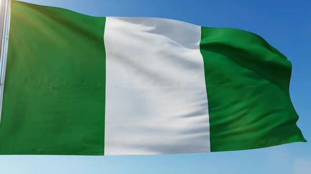 Nigerian flag waving in sky