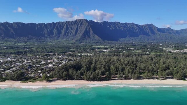 Elevated 4k view of waimanalo beach on oahu hawaii showing beautiful ocean and white sand beach with koolau mountains in background and waimanalo town