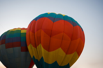 colorful hot air balloons glowing against sky