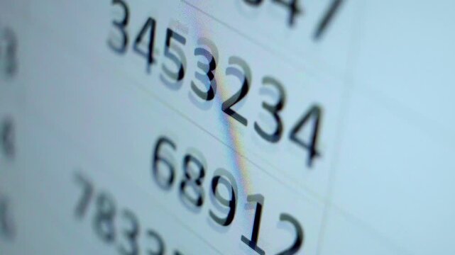 Digital data analysis on a computer screen with abstract numbers scrolling, representing financial statistics or code
