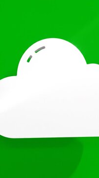 A simple, white cloud with shadows against a vibrant green background