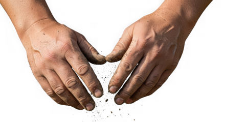 Two dirty hands form shape of heart with soil falling from fingertips against isolated background