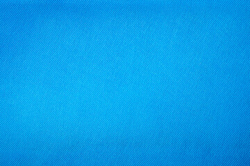 Close-up of a vibrant blue textile material.  clean and uniform woven fabric surface is perfect for fashion backgrounds, creative crafts, and industrial design.