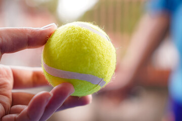 Tennis Ball in Hand Ready to Serve Outdoor
