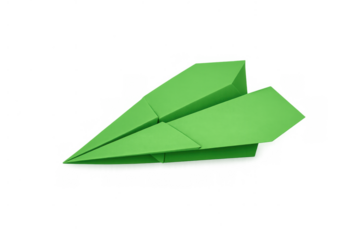 Green paper airplane representing childhood dreams, creativity, and the concept of travel, innovation, and starting new adventures