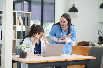 Fototapeta premium Two female doctors are having a meeting in the clinic. 