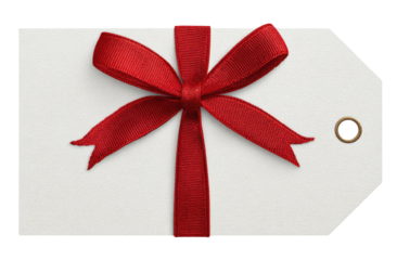 Close-up of a white gift tag with a bright red ribbon tied into a bow
