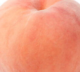Fototapeta premium Full close-up of peach skin texture with soft fuzz, fresh warm lighting