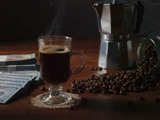 Fototapeta premium coffee beans on the background of a coffee cup and money. the concept of coffee.