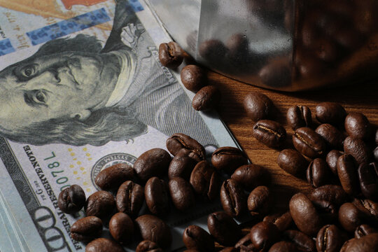 coffee beans on the background of a coffee cup and money. the concept of coffee.