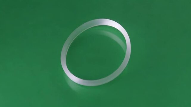 3D rendering of a white circular loading bar or progress spinner against a solid green background, representing a waiting process or system update.