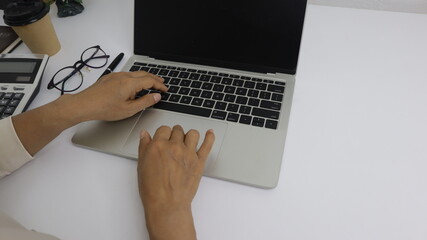 businesswoman working use laptop in office for discussing documents and ideas , with soft focus, vintage tone