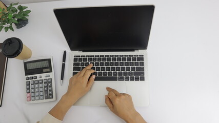 businesswoman working use laptop in office for discussing documents and ideas , with soft focus, vintage tone
