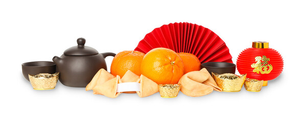 Display of oranges, tea set, red fan, and gold items, isolated, PNG