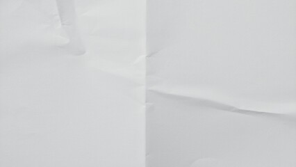 Crumpled white paper texture with visible fold lines. Wrinkled folded paper sheet pattern. Clean...