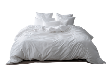 Cozy white bedding on a bed with multiple pillows arranged neatly for a comfortable setting