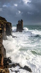 A rugged coastline with waves crashing against the rocks and a ruined tower
