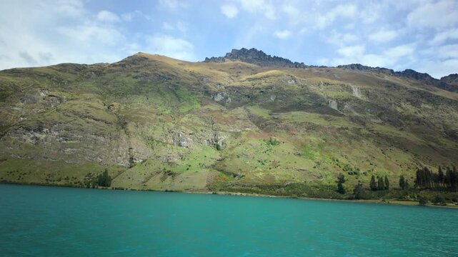 Boat View Of Turquoise Lake And Mountain Ridge