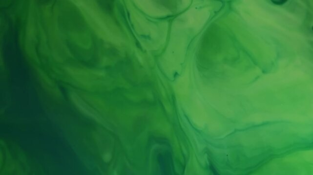 Ripple paint. Splattered color. Defocused green splash water shine spill ink sparkle natural texture on abstract art wet background.