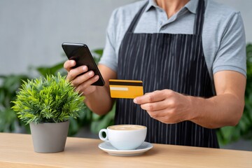 Barista making mobile payment with credit card