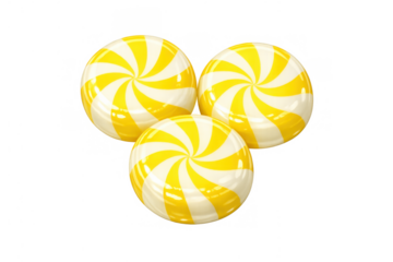 Three round yellow striped hard candy sweets with a swirl pattern, delicious confectionery treat on transparent background