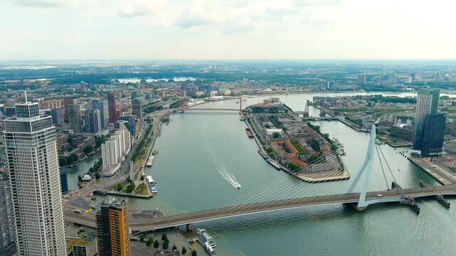 Rotterdam, Netherlands. Erasmus Bridge. Noordereiland Island. View of the city center. River Nieuwe Maas. Summer day, Rainy clouds. Drone footage