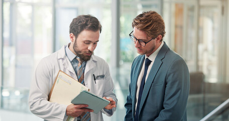 Fototapeta premium Doctor, businessman and tablet with meeting in clinic for appeal process, clarify billing info or claim. Health insurance specialist, men and tech in hospital for case management and policy coverage