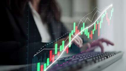A businesswoman is using a computer to analyze financial data. The digital screen displays a graph showing growth trends in the stock market, illustrating investment strategies. Copula - Powered by Adobe
